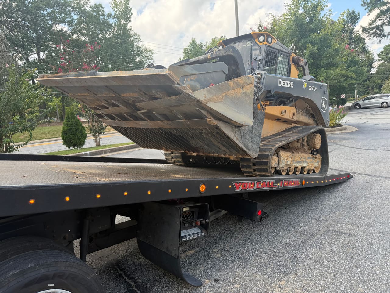 John Deere compact track loader secured on an R3P Transport rollback