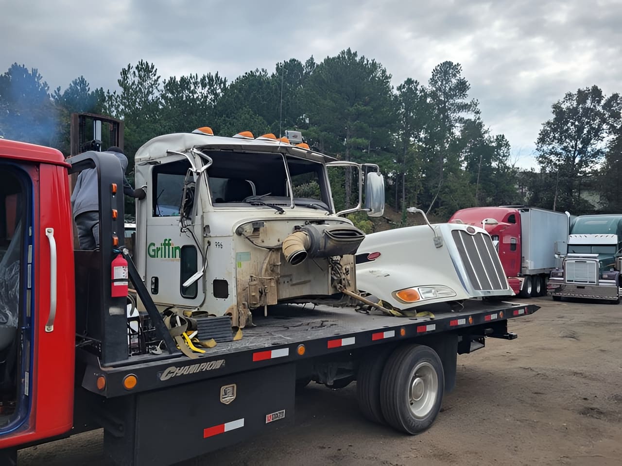 Damaged semi-truck cab loaded on an R3P Transport rollback